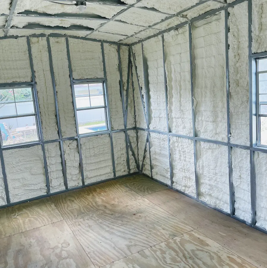 Closed-cell spray foam insulation applied to wall cavities in a residential project in Edgemoor